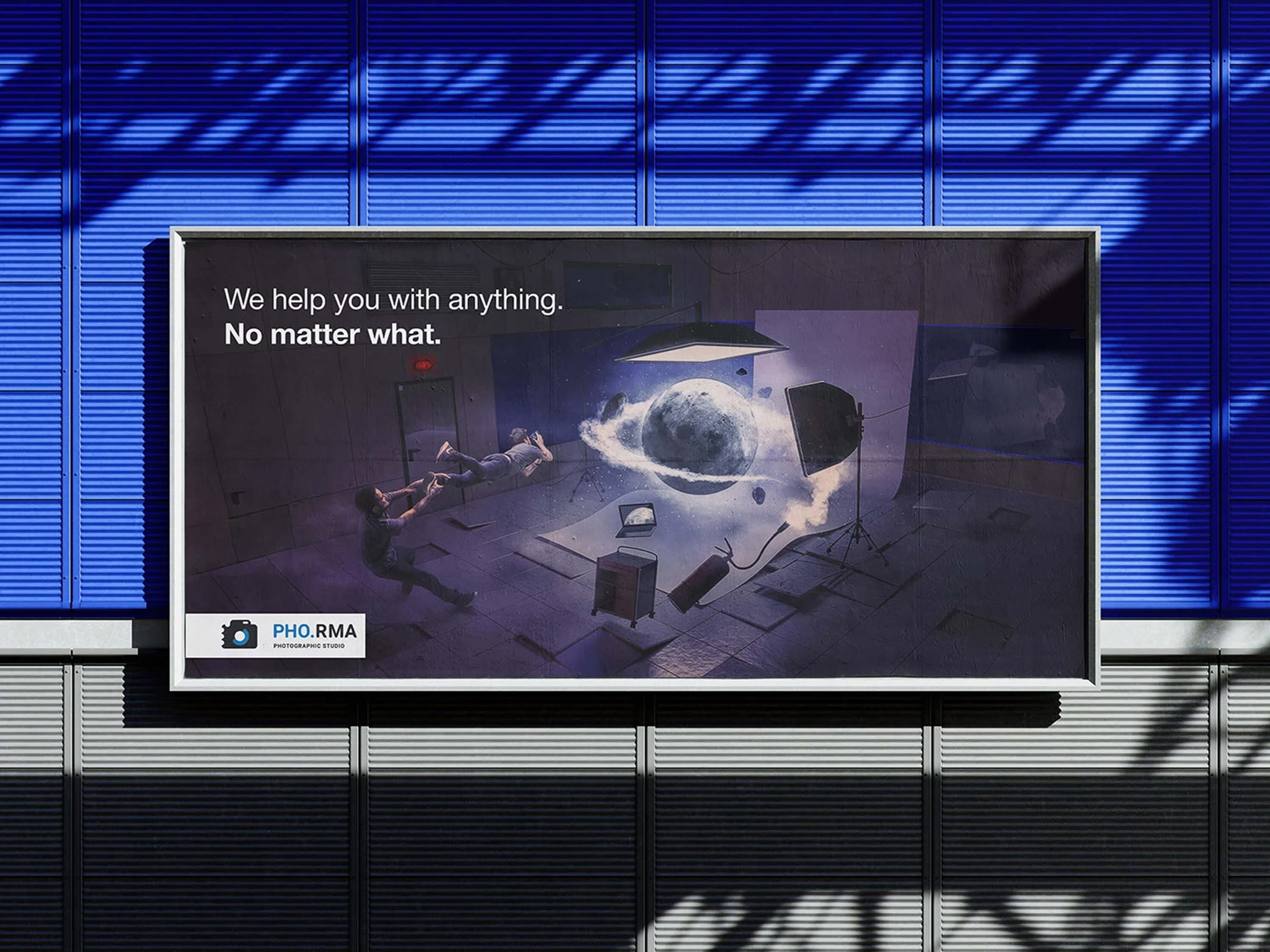 The Moon billboard on the blue louvred facade, with the campaign line and the studio logo